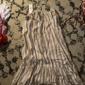 Tan and white vineyard vines cover up. Beach